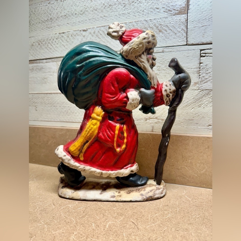 CAST IRON, OLD MAN SANTA DOOR STOP.HAS A COUPLE OF SMALL CHIPS.GOOD CONDITION.